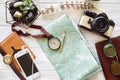 wanderlust and travel concept. compass and pencil on map exploring. passport money glasses photo camera on white wooden Royalty Free Stock Photo