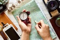 Wanderlust and travel concept flat lay. hand holding compass and Royalty Free Stock Photo