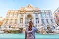 Wanderlust Travelling Girl in front of Trevi Fountain and Italian Statues in Rome, Italy Royalty Free Stock Photo