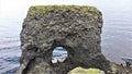 A tunneled basaltic rock on the coast of RauÃÂ°anes on the coast of Island Royalty Free Stock Photo