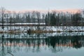 Wangen an der Aare, Switzerland, 12. December 2021: View to the Aare River with Reflection of the evening Landscape.