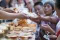 Wangfujing street, Beijing, China - 08 01 2016:Woman buying street food in Wangfujing street, a shopping street in Beijing, China Royalty Free Stock Photo