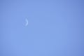 Waning Crescent Day. Lunar phase, bright illuminated moon during the day.