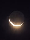 Waning Crescent Moon in October with moonglow Royalty Free Stock Photo