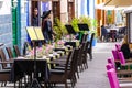 Festively set tables in the outdoor catering of a restaurant