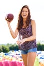 Wanna play. an attractive young woman holding a football.