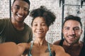 We want everyone to know just how how exercise make us feel. three sporty young people taking a selfie at the gym.