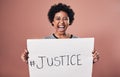 We want justice and we want it now. Studio shot of a young woman holding up a poster reading JUSTICE.