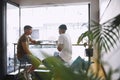 Want to do this again. two young men talking while having coffee together in a cafe. Royalty Free Stock Photo