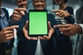 Want your business to stand out Move it online. a group of businesspeople pointing to a digital tablet with a chroma key Royalty Free Stock Photo