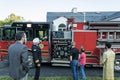Fireman demonstrates equipment on firetruck just blessed