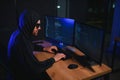Wanted hackers coding virus ransomware using laptops and computers. Cyber attack, system breaking and malware concept Royalty Free Stock Photo