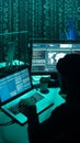 Wanted hackers coding virus ransomware using laptops and computers. Cyber attack, system breaking and malware concept.