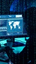 Wanted hackers coding virus ransomware using laptops and computers. Cyber attack, system breaking and malware concept.