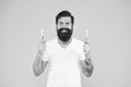 Wanted happy teeth. Happy hipster hold brushes yellow background. Bearded man happy smiling with toothbrushes. Dental