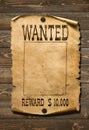 Wanted wild west poster on old wood background Royalty Free Stock Photo