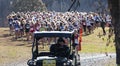 Golf cart leads high school girls cross country race Royalty Free Stock Photo