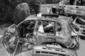 War-destroyed cars in Irpin, Bucha district, Ukraine, black and white