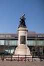 War Memorial bronze statue on stone plinth with poppy wreaths in Old Eldon Square Newcastle upon Tyne