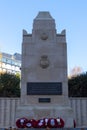 The war memorial in Portsmouth Surrounded by poppy wreaths for remembrance day