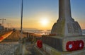 War Memorial and Red Poppy Wreaths at Sunrise