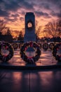 war memorial with wreaths and candles at dusk