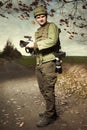 War photographer in conflict zone preparing for job