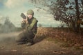 War photographer in conflict zone preparing for job