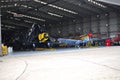 War planes WW2 P40 Curtis and F4U Corsair in a hangar