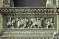 War scene with elephants and horses relief in stone on the gate of Maheshwar Temple