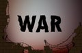 War text on the background with broken brick wall and barbed wire,