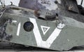 War in Ukraine. Destroyed tank with torn off turret. Broken and burned military tanks. Designation of a sign or symbol in white Royalty Free Stock Photo