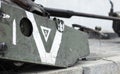 War in Ukraine. Destroyed tank with a torn off turret with a V on it. Broken and burned Russian tanks. Designation sign or symbol