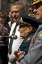 War veteran man portrait. He makes a speech.