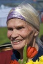 War veteran woman portrait. She holds flowers.