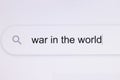 War in the world - Internet browser search bar typing hypotetical world conflict text . Typing the word War in the world