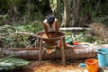 Warao Woman doing Bread with Flour made from Palmtree, mauritia flexulosa, Indians living in Orinoco Delta, Venezuela