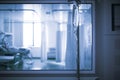 Ward behind the glass viewing window in the hospital hallway  unfocused background Royalty Free Stock Photo