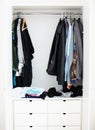 Wardrobe, clothes and home interior, shelf and fashion in room at house or apartment. Closet, clothing or rack for