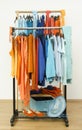 Wardrobe with complementary colors orange and blue clothes.