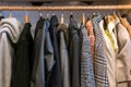 Wardrobe full of different color, material and texture clothes,