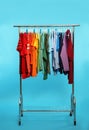 Wardrobe rack with different bright clothes Royalty Free Stock Photo