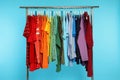 Wardrobe rack with different bright clothes Royalty Free Stock Photo