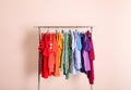 Wardrobe rack with different bright clothes Royalty Free Stock Photo