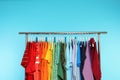 Wardrobe rack with different bright clothes Royalty Free Stock Photo