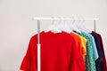 Wardrobe rack with different bright clothes Royalty Free Stock Photo