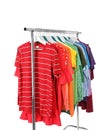 Wardrobe rack with different colorful clothes on white Royalty Free Stock Photo