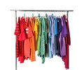 Wardrobe rack with different colorful clothes on white Royalty Free Stock Photo