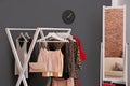 Wardrobe rack with women`s clothes