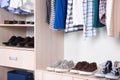 Wardrobe shelves with different stylish shoes